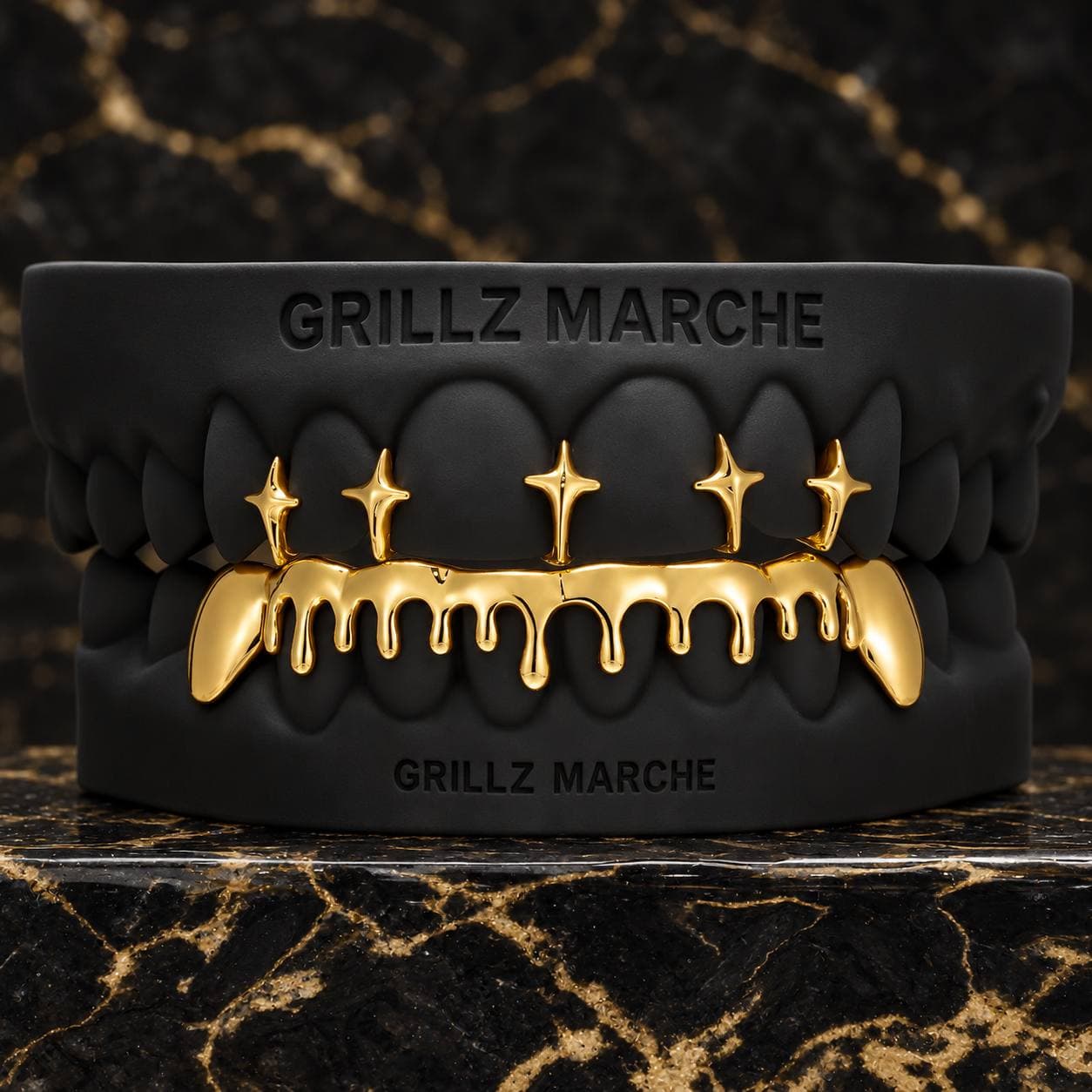Stelline sopra e drip sotto: grillz su misura su 14 denti, finitura PVD effetto oro