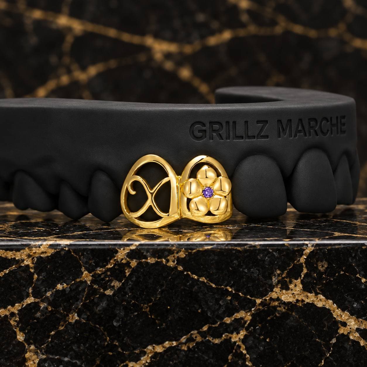 Fiore e nodo: grillz con pietre su misura su 2 denti, finitura PVD effetto oro
